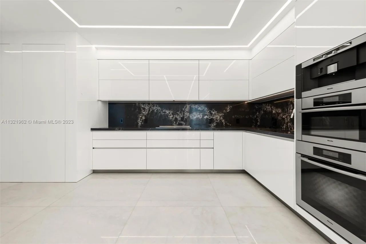 Modern Gourmet Kitchen with Luxurious Stainless-Steel Appliances at Continuum South Tower, South-of-Fifth
