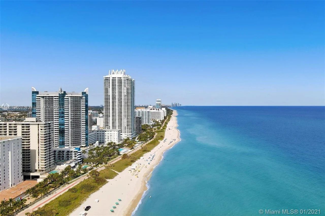 Aerial View of La Gorce Palace With Its Luxurious Exterior Showcasing Private Beach Areas and the Surrounding Upscale Miami Beach Neighborhood