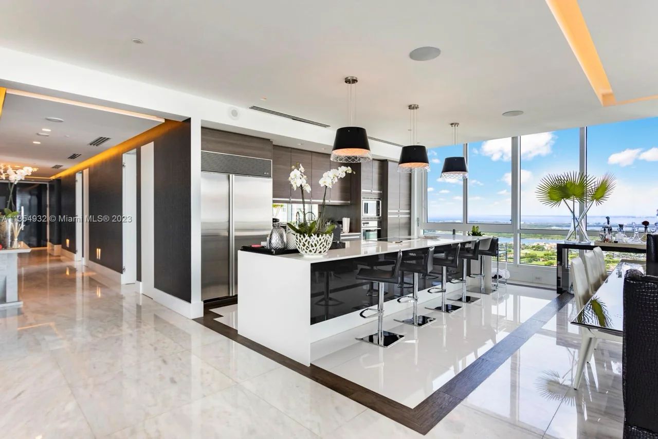 Modern Gourmet Kitchen with Luxurious Stainless-Steel Appliances at Continuum North Tower, South-of-Fifth