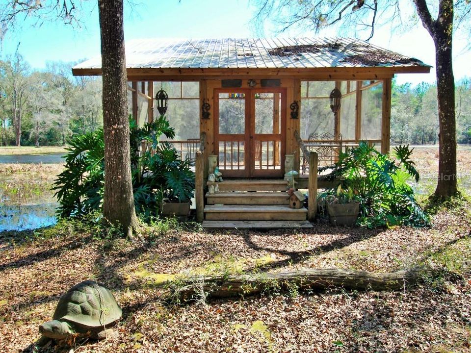 Screened porch overlooking pond