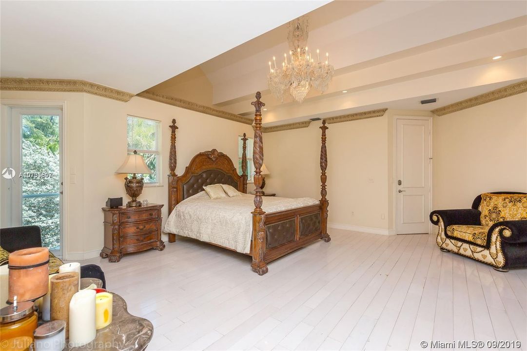 Master Bedroom upstairs with ocean and pool views, classic masterpiece