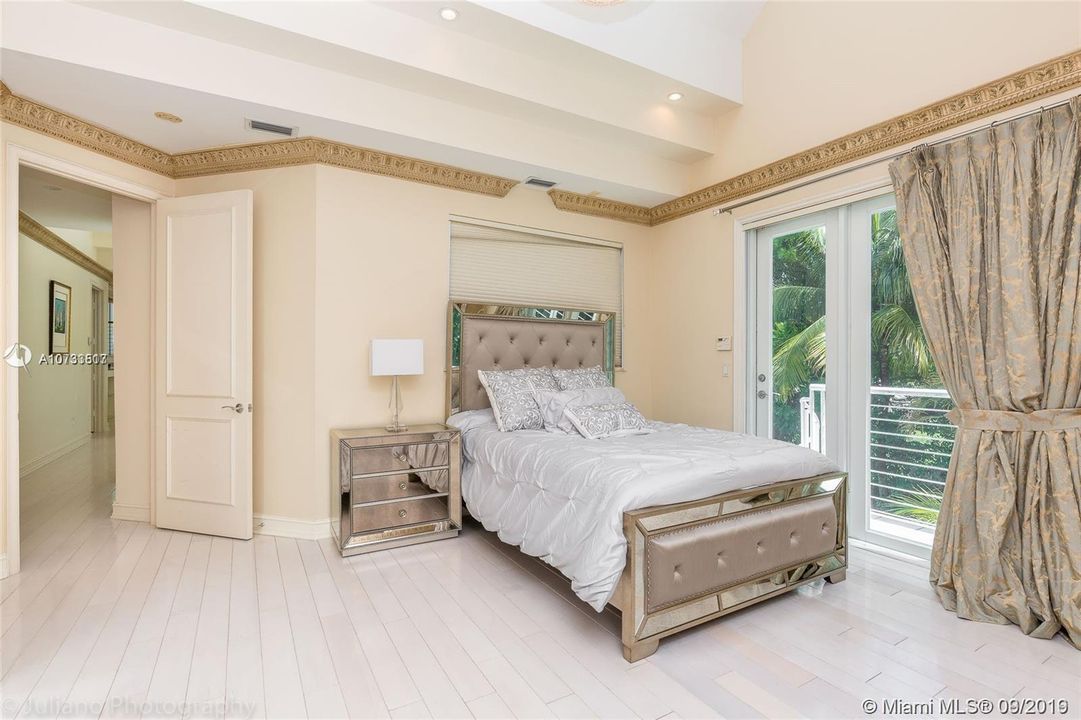 Guest bedroom upstairs, queen bed, wood floors, balcony, beautiful furniture