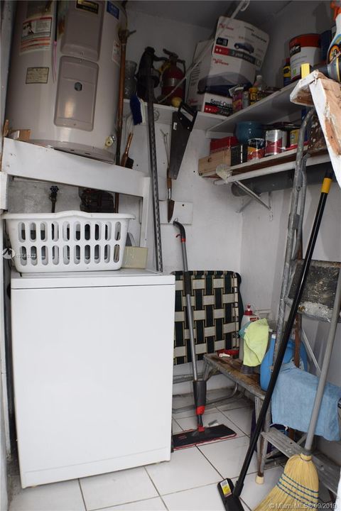 Utility closet in rear has washing machine, no dryer. Dryer hook up in utility closet