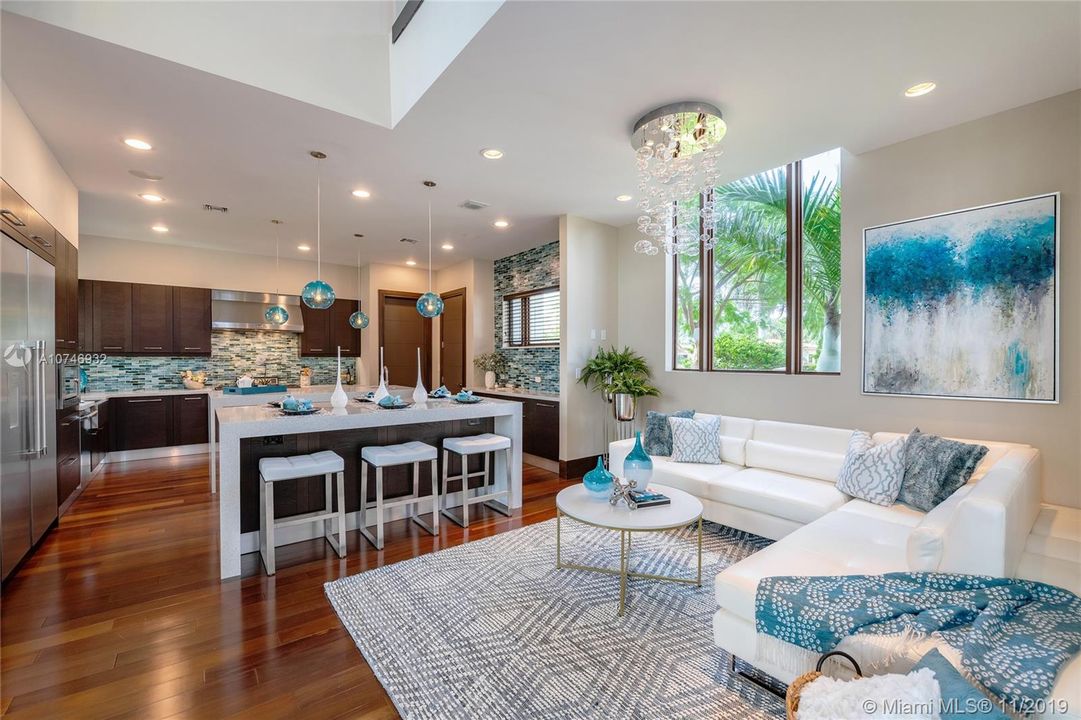 Kitchen lounge, Italian Cabinetry, 2 Islands w/ waterfall quartz counters with ample seating.