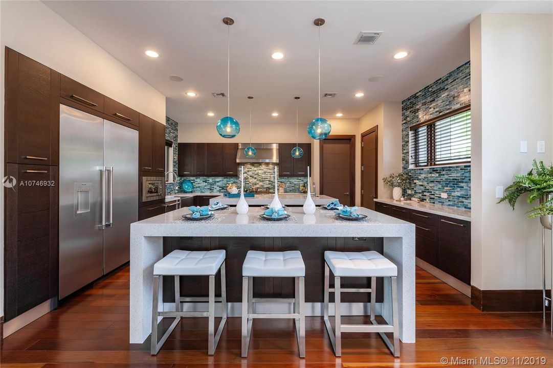 Thermador professional grade stainless steel appliances: natural gas stove, built-in separate refrigerator and freezer.  Chefs Kitchen, great for entertaining.  Italian Cabinetry, 2 Islands w/ waterfall quartz counters with ample seating.