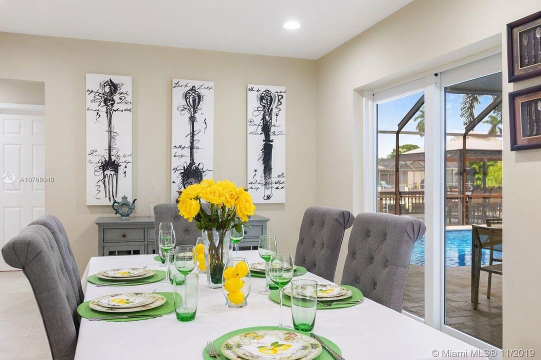 Dining Area with Fold-in Sliders to Outdoor Patio and Pool