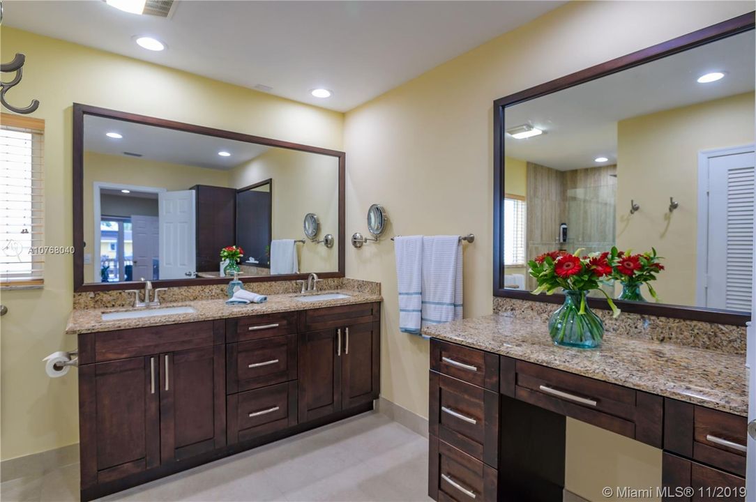 Master Bedroom with Dual Sinks and Vanity