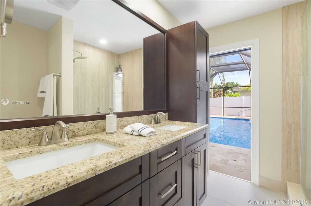 Guest Bathroom - Dual Sink and Cabana Door to Pool