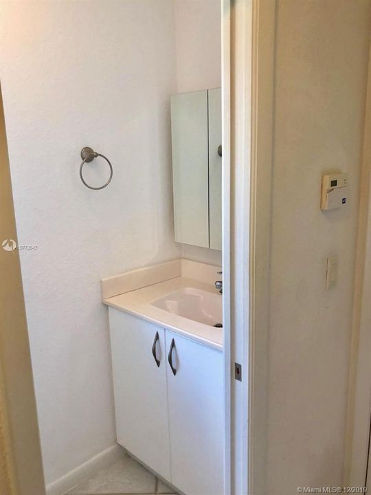 Half bath next to exit to garage