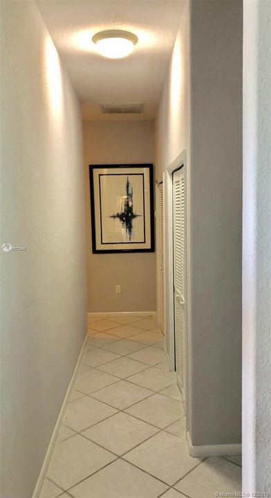 Hallway with two storage closets