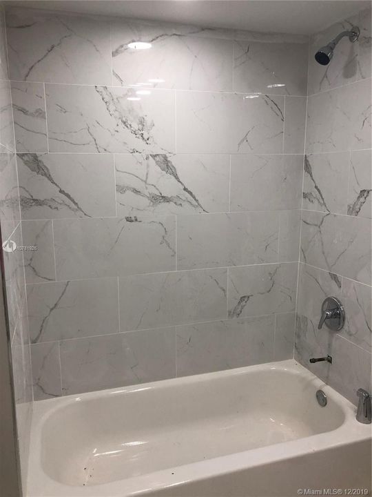 Bathtub w/ new tiling