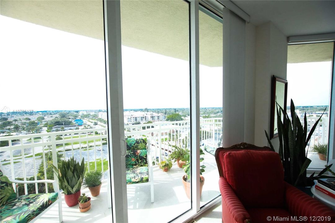 Impact Glass Doors that leads to the large balcony with an amazing view of the Ocean & City.
