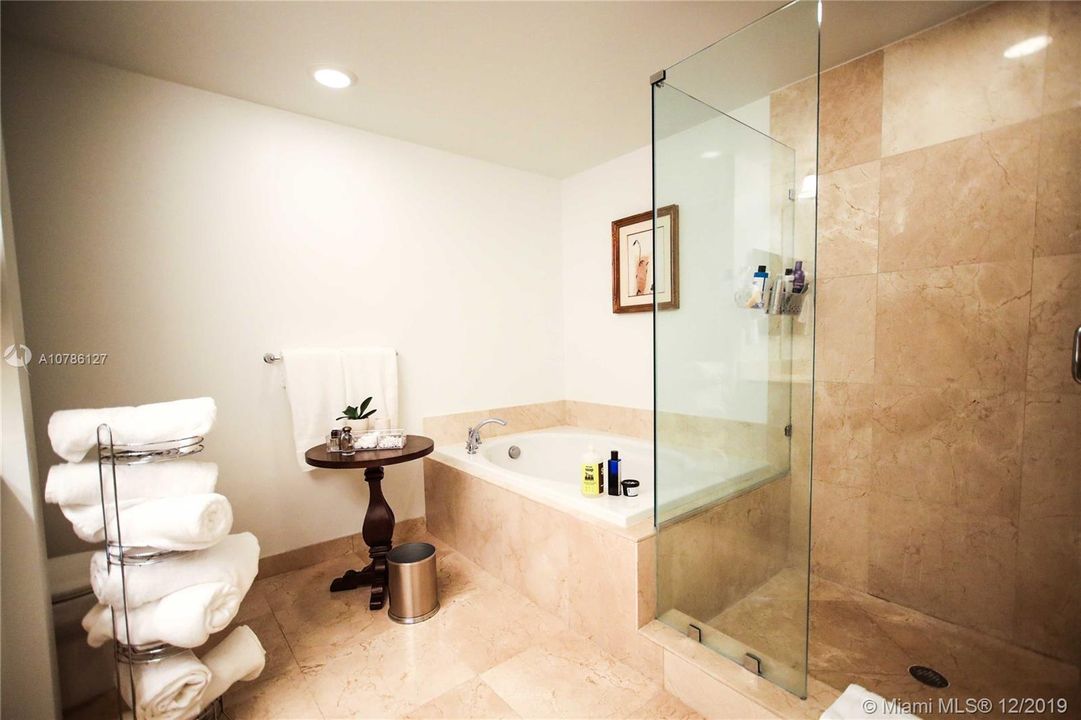 Master Bathroom with separate Tub and Shower. Marble Floor.