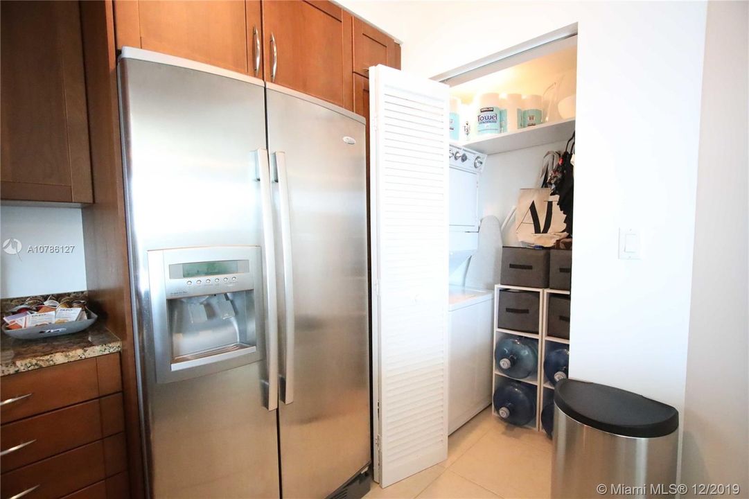 Laundry room with a full washer and dryer.