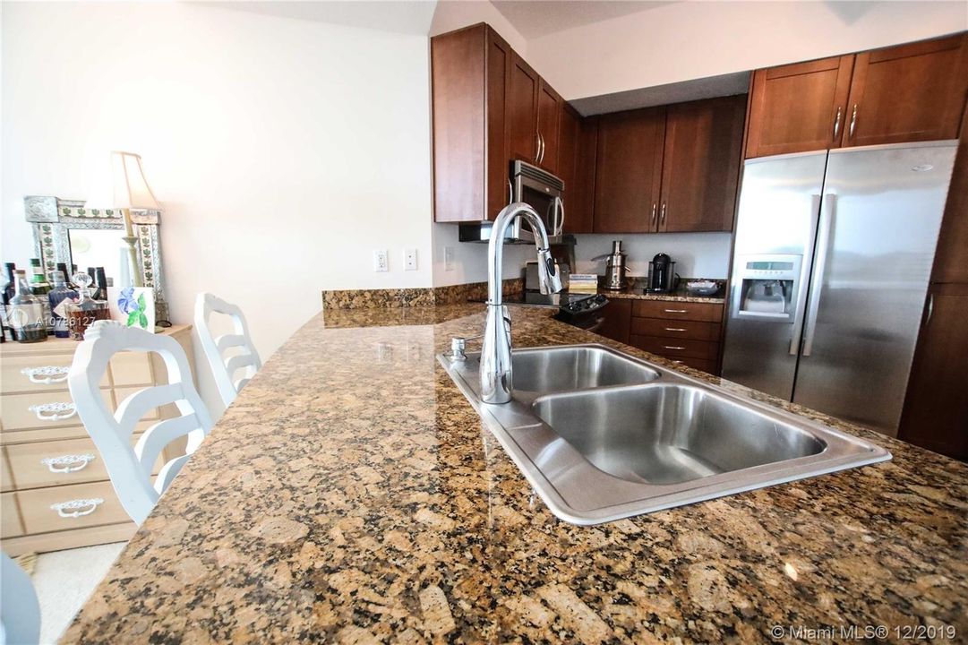 Kitchen with granite counter-top.