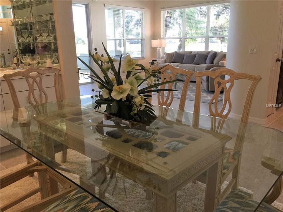 This dining room table is set up so beautifully you will want to invite all of the new friends you have made at VGCC over for dinner and drinks......wet bar is conveniently built-in this bar area of dining room!