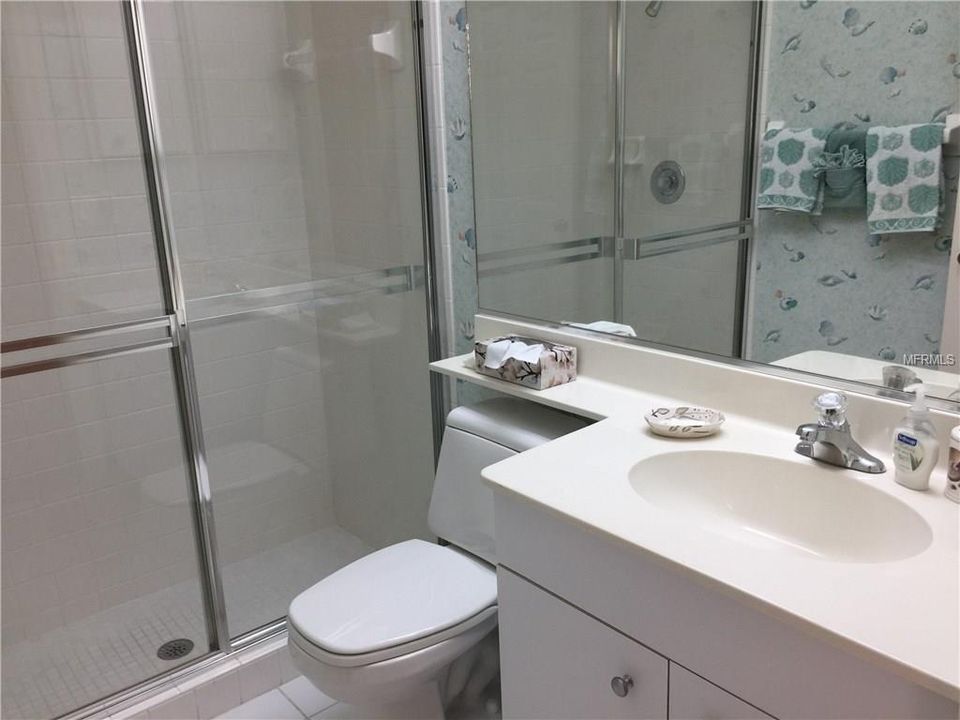 Guest bath is nice and bright for guest to shower after enjoying a hot day on the golf course!