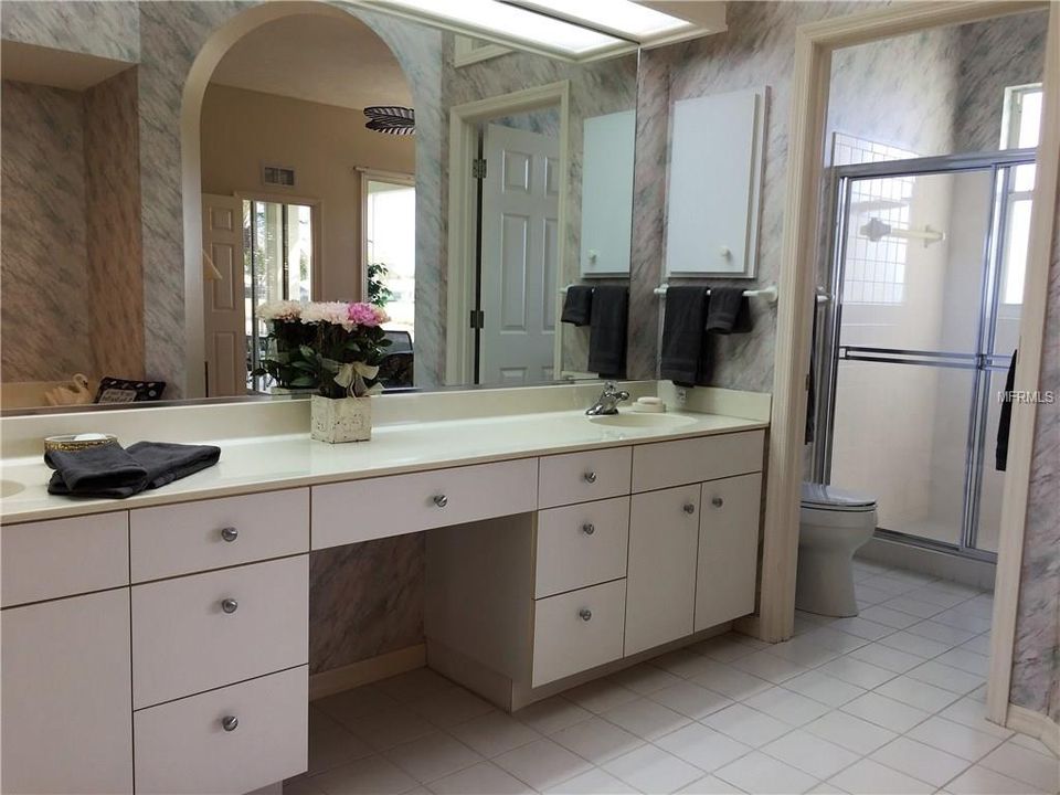 Double sinks with make-up vanity in the middle........plenty of room for both!