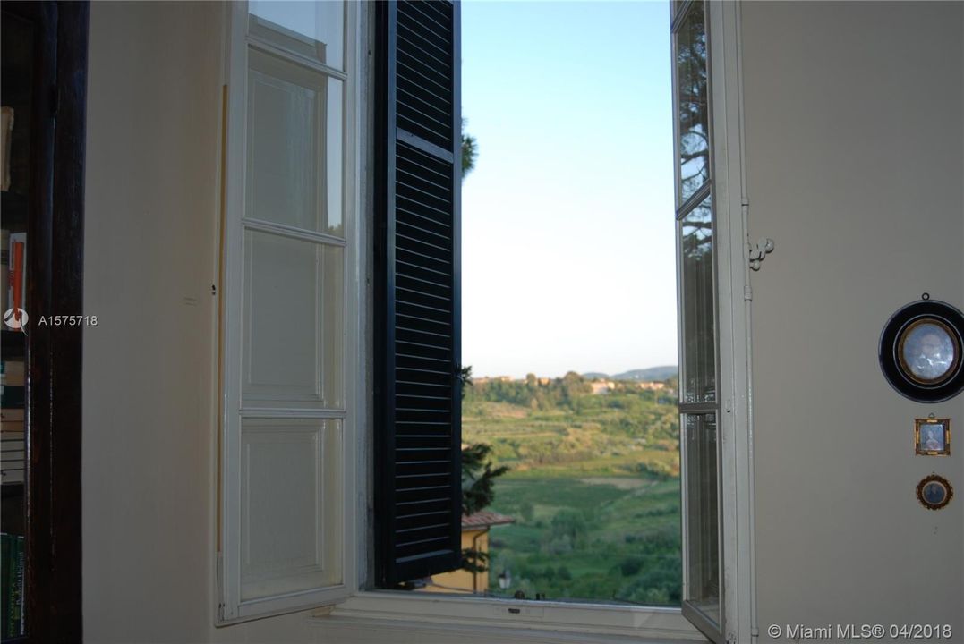 Window looking out over the Tuscan hillside