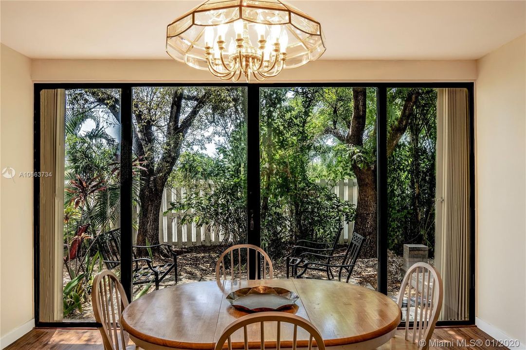 Back area with dining room space. Perfect for family meals or BBQing outside while enjoying friends and family.