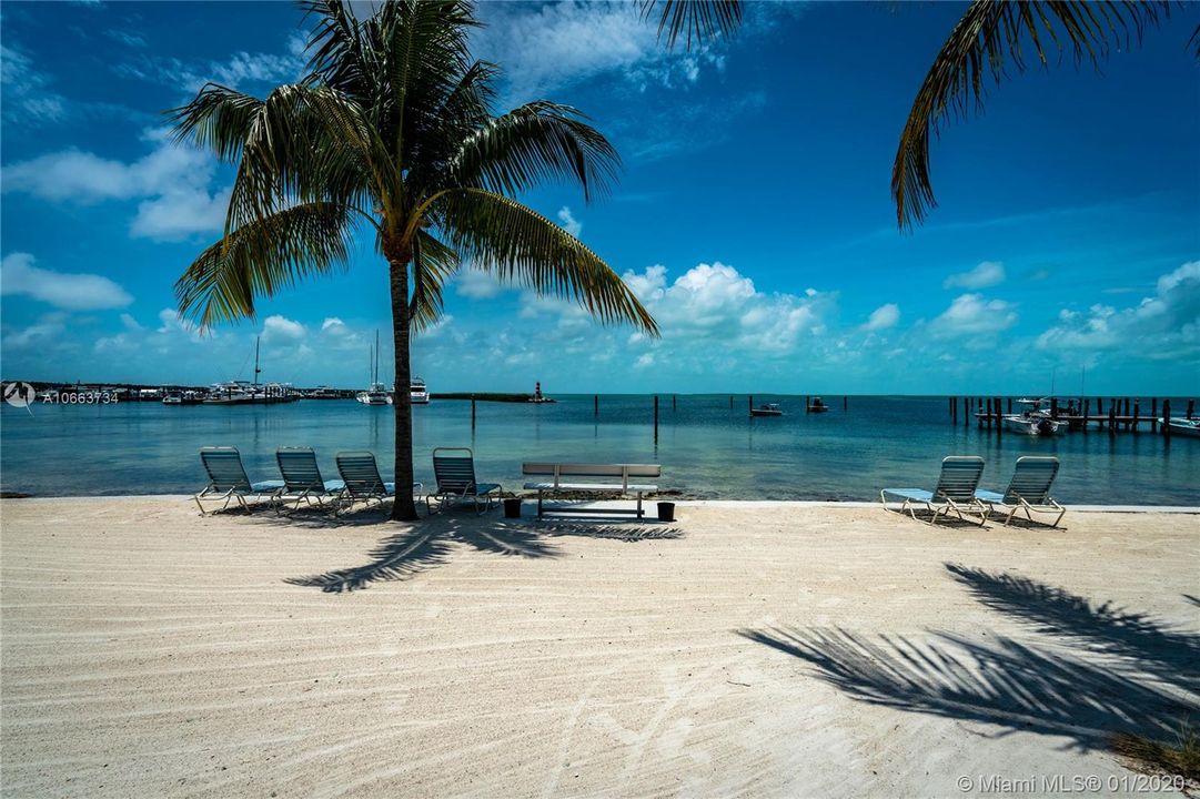 Private Keys style beach maintained daily with beautiful views of the neighboring Marina.