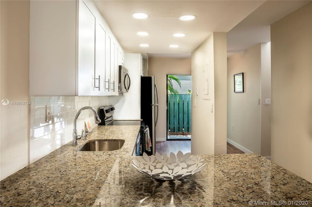 Renovated Kitchen with BRAND NEW cabinets, granite tops, and appliances.