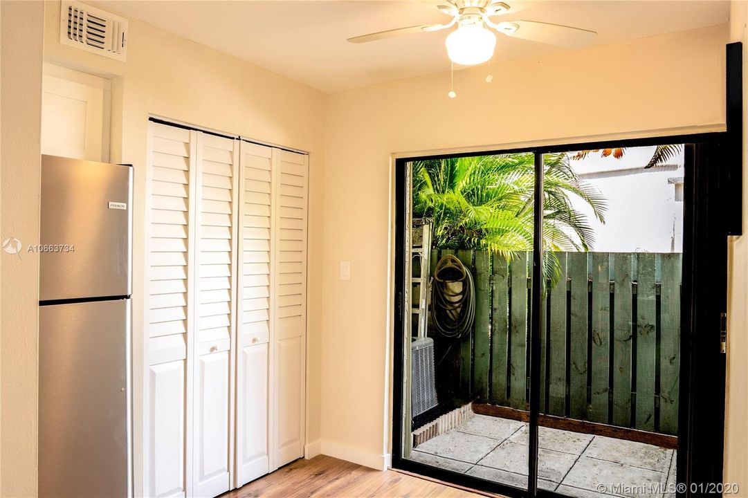 Pantry with cozy eat-in area as well as gated front porch.
