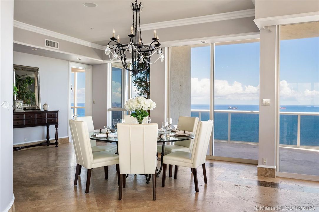 Formal dining room with balcony and views