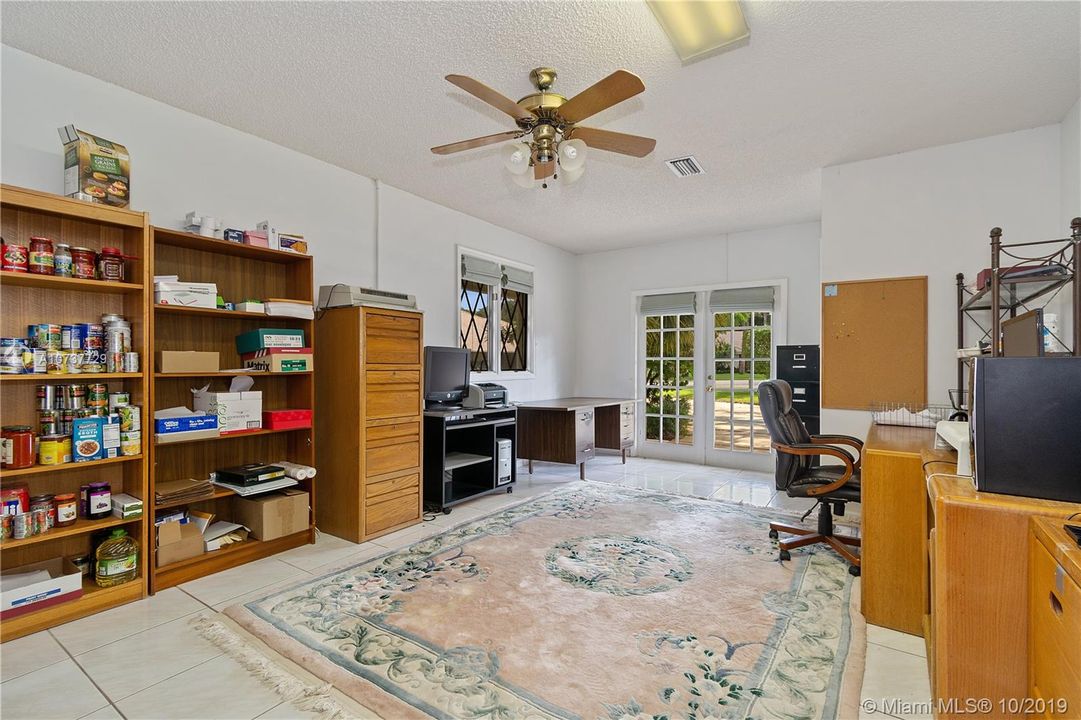 Office has a closet and french doors with side entry to the house. Perfect home office or mother-in-law suite.