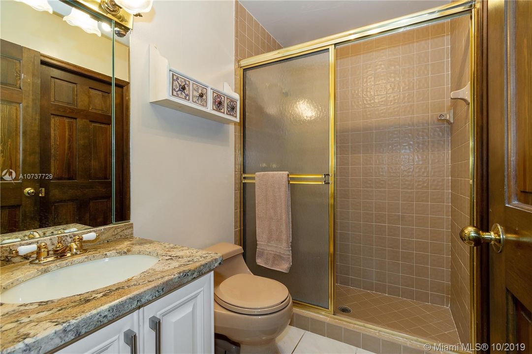Guest Bathroom off of kitchen, Family Room and the two Dens.