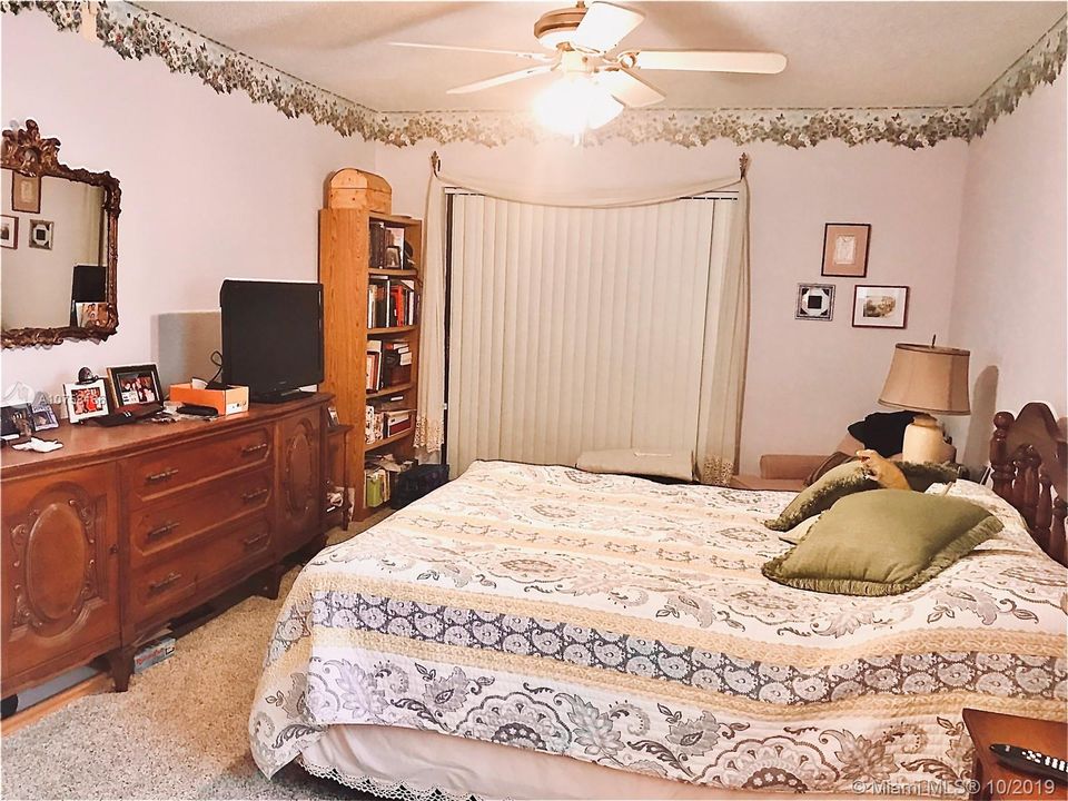 MASTER BEDROOM HAS SLIDERS TO SCREENED PORCH