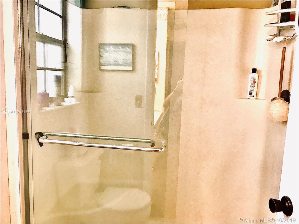 WALK-IN MASTER SHOWER HAS BUILT-IN SEAT