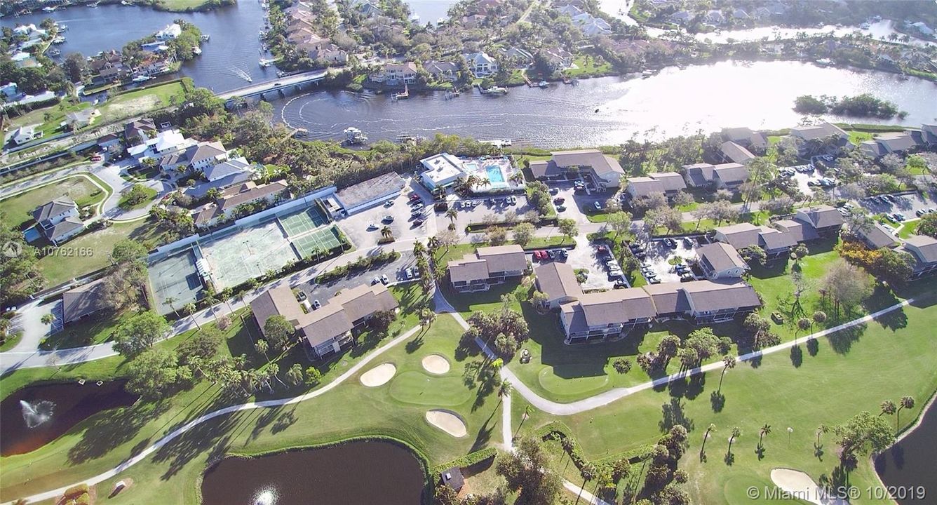 Aerial views of Riverbend CC condo across from the pool and river.