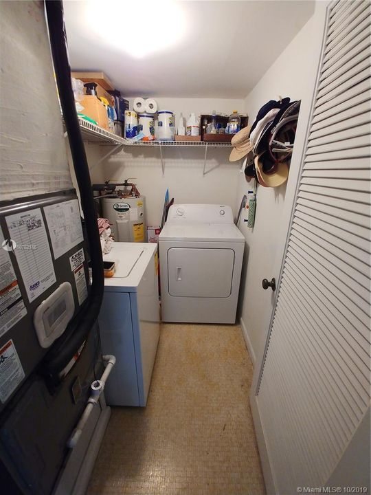 Large walk in laundry room.