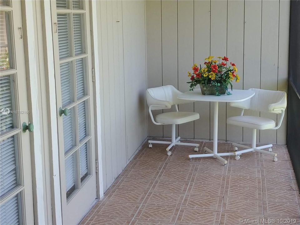 Large screen balcony over looking the golf course and pond.