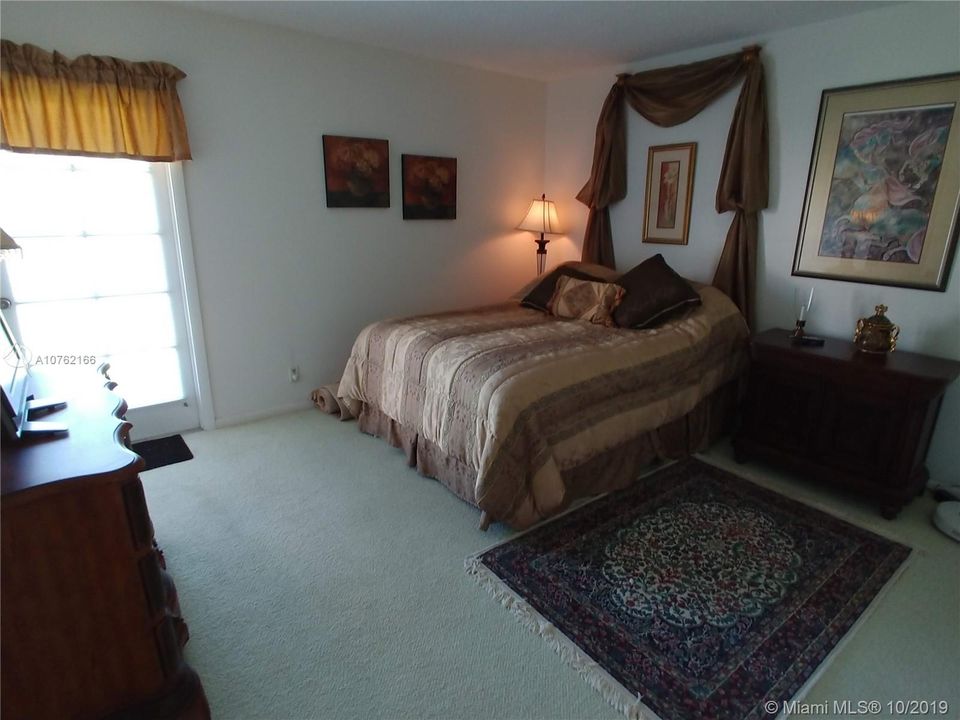 Guest bedroom with French Door out to balcony.