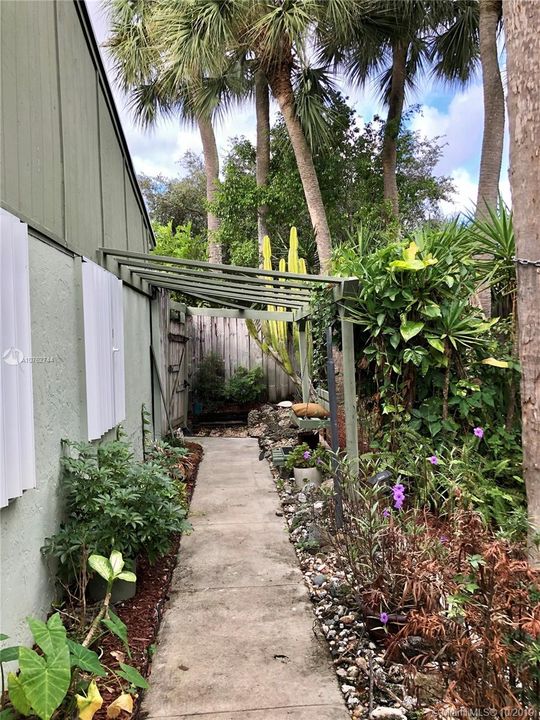 Private entrance to the unit on the side of villa