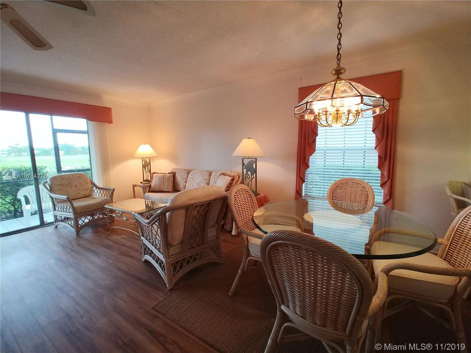 Living room /Dining area with golf course views.