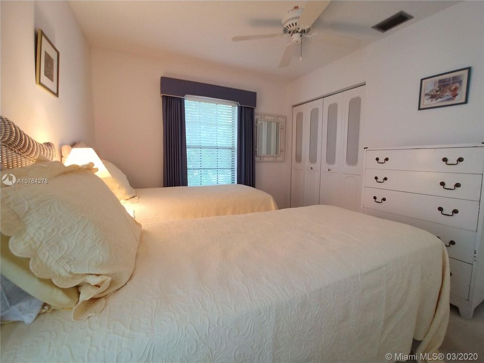 Guest bedroom with large walk in closet.