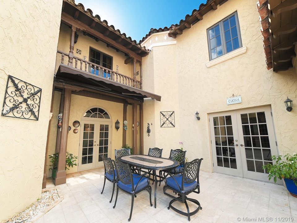 803 N. Greenway Dr., Coral Gables - romantic courtyard with access from kitchen, living room and family room (or ground floor master), leading to the pool area, perfect for your outdoor parties