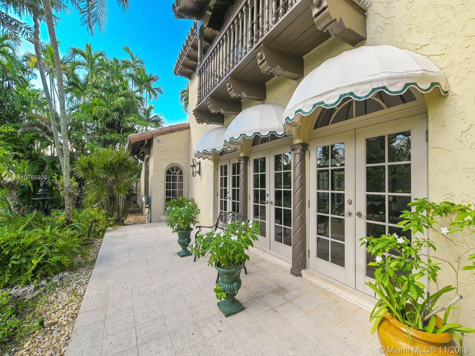 803 N. Greenway Dr., Coral Gables - Front of the house, the French door (all impact) open onto the living room