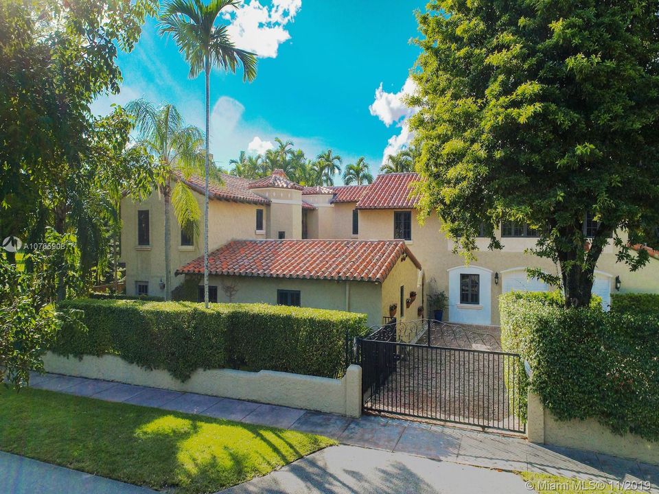 803 N. Greenway Dr., Coral Gables - Walled and gated, 2-car tiled garage. 2 washers, 2 dryers, extra fridge, built-ins