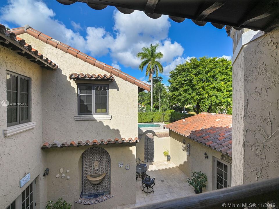 803 N. Greenway Dr., Coral Gables - Master bedroom terrace overlooking one of the courtyards
