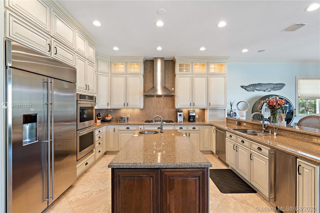 Kitchen with all new appliances, including a wine cooler and ice machine.