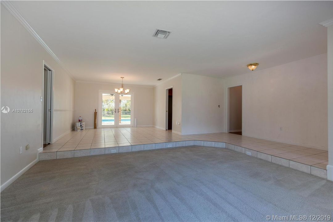 Living & Dining Room with view of the pool & patio