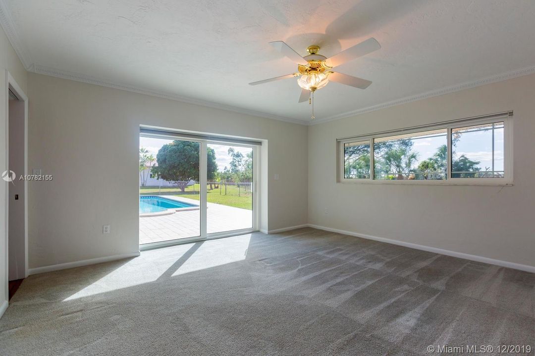 Master Bedroom with doors to the pool