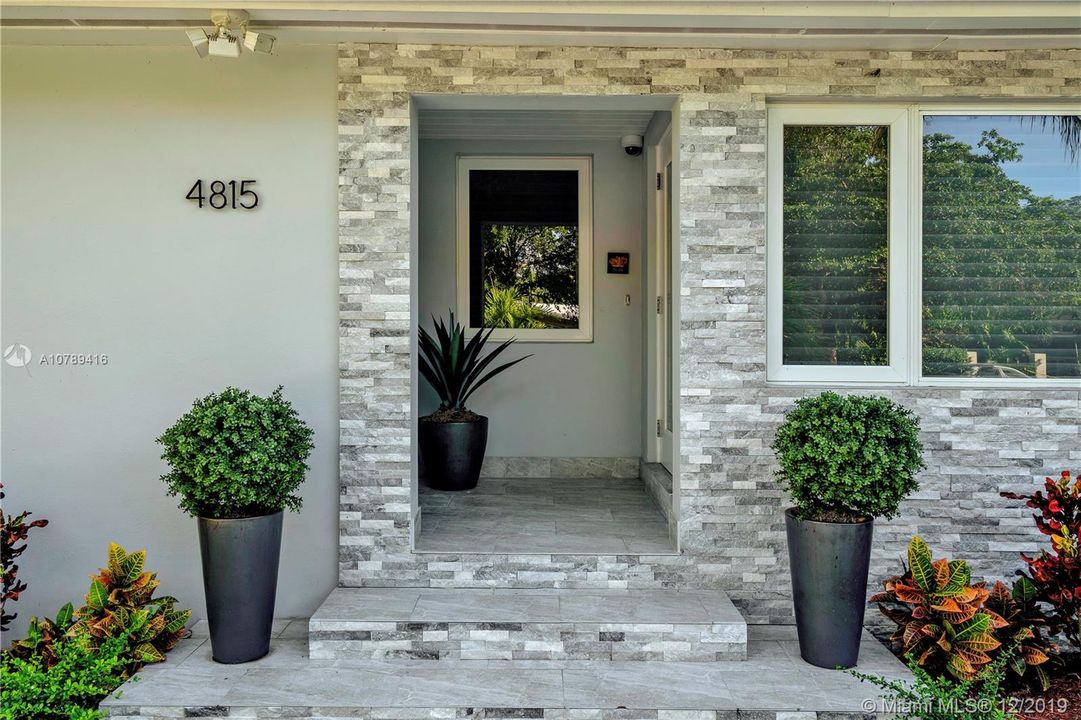 Front entrance with stone facade
