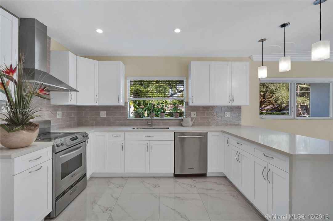 Remodeled mid-2019, shaker cabinets with all quartz counter top and waterfall peninsula