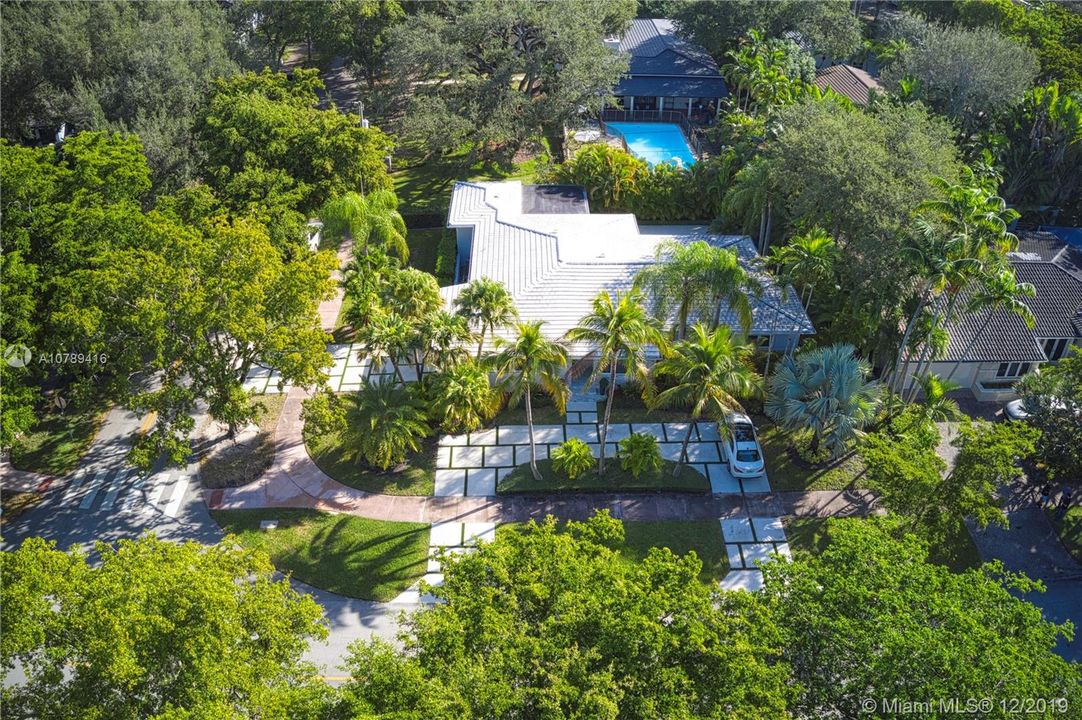 Aerial view of the house, circular driveway and garage entrance around the corner.