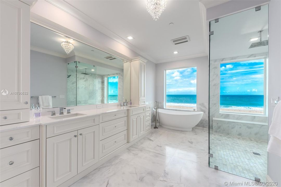 Master bathroom with wood mode cabinets and quartz countertops.  Dual sinks and perfect ocean views!